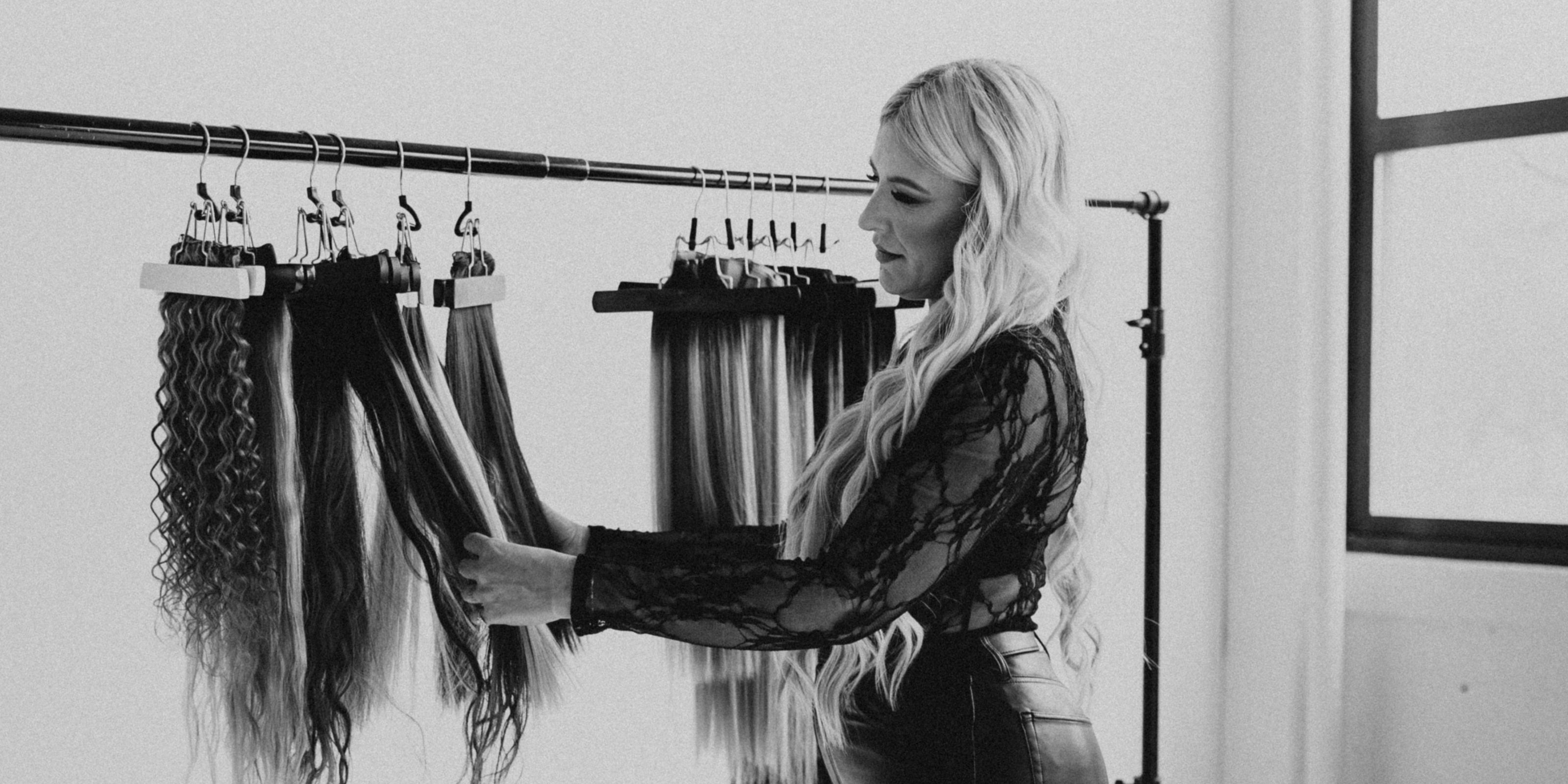 Jessie with long, wavy hair created using Stitched Seam Wefts™