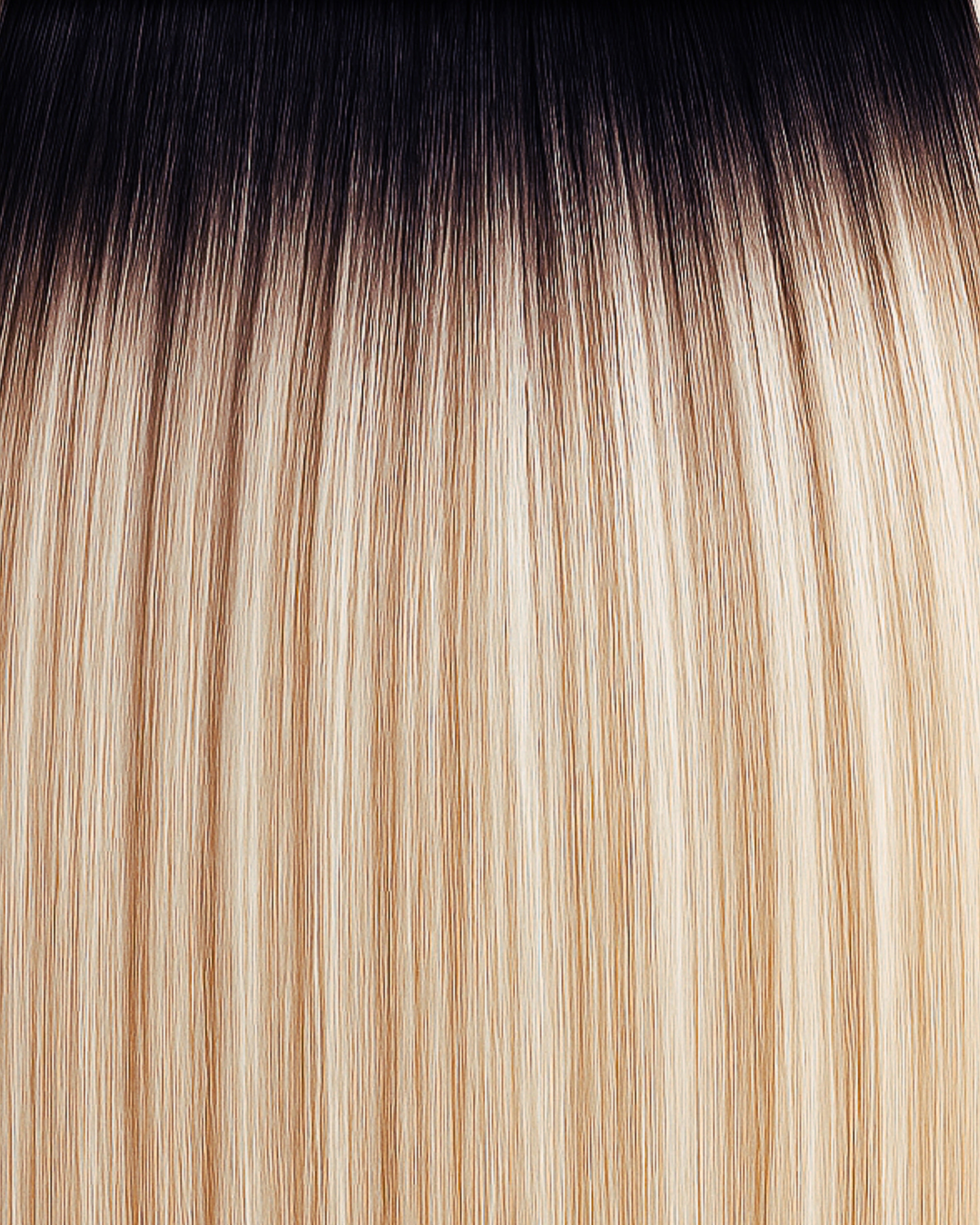 Stitched Hair Bold Genius Weft™ extensions in rooted golden bronde with 9 ash, 6 neutral tones, and a level 1 dark root, shown in soft balayage strands.