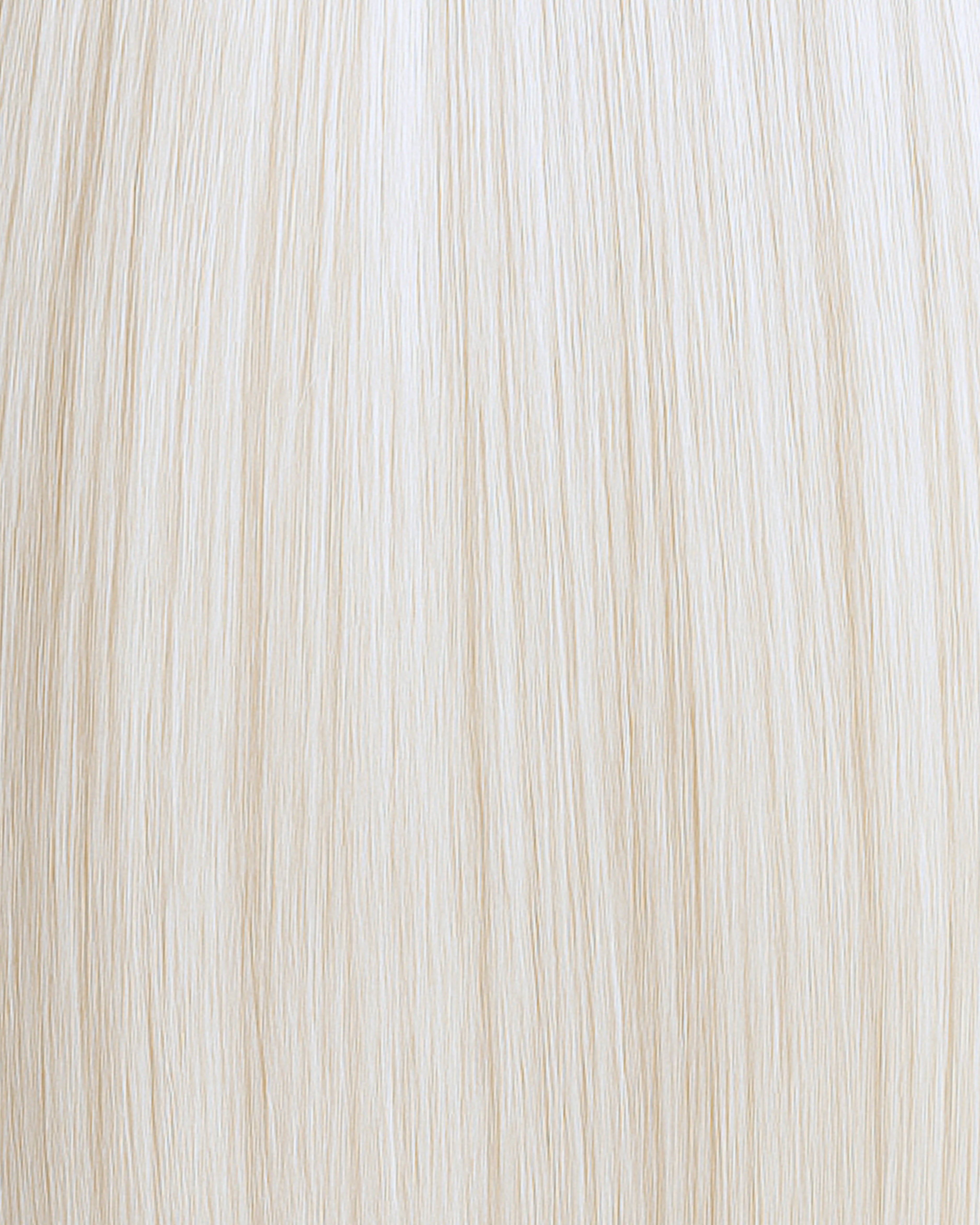 Stitched Hair Light Genius Weft™ extensions in platinum blonde with 10 ash undertones, shown in straight cool-toned strands.