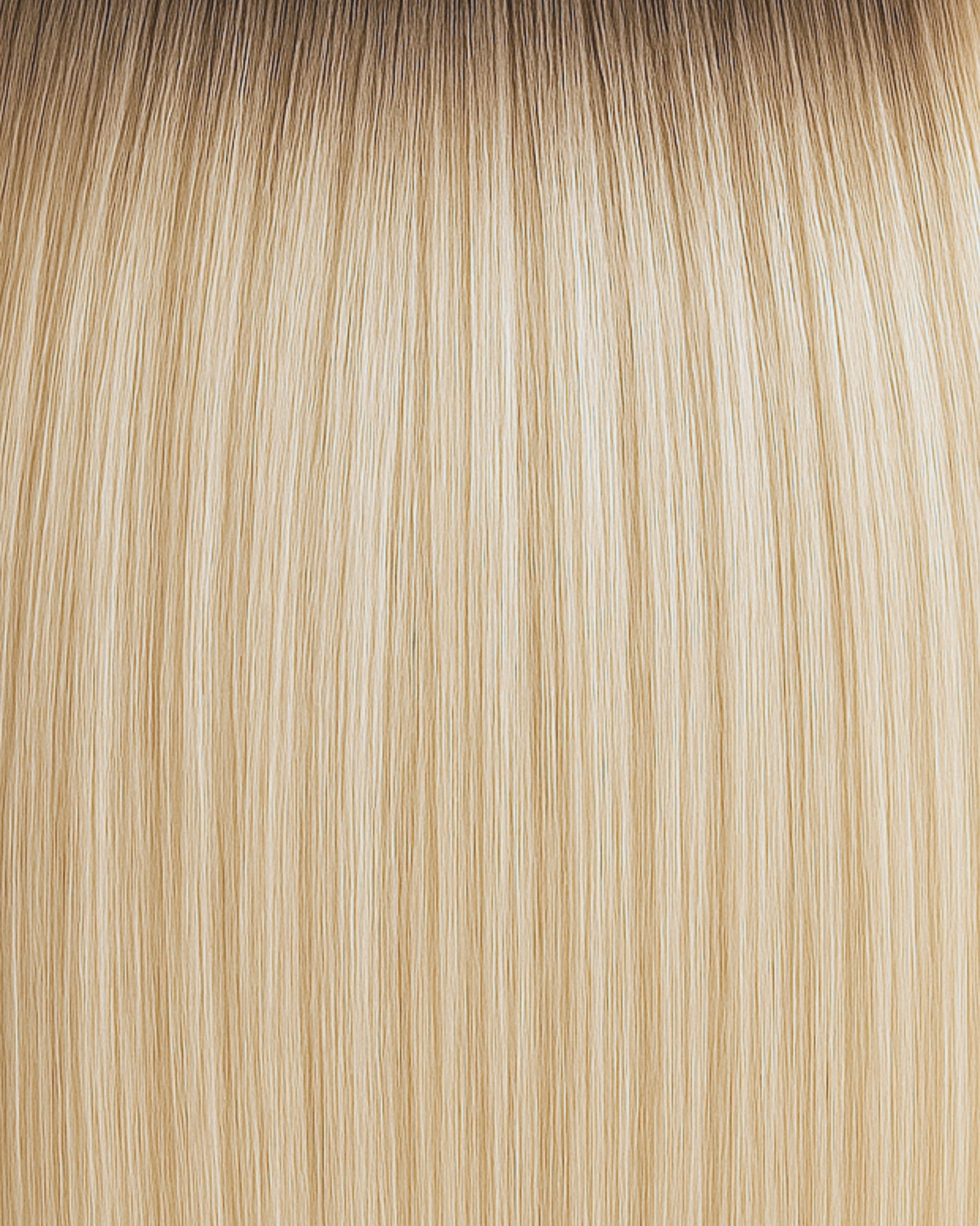 Stitched Hair Bloom Genius Weft™ extensions in rooted dimensional blonde with a warm and ash blend and a natural Level 8 root.