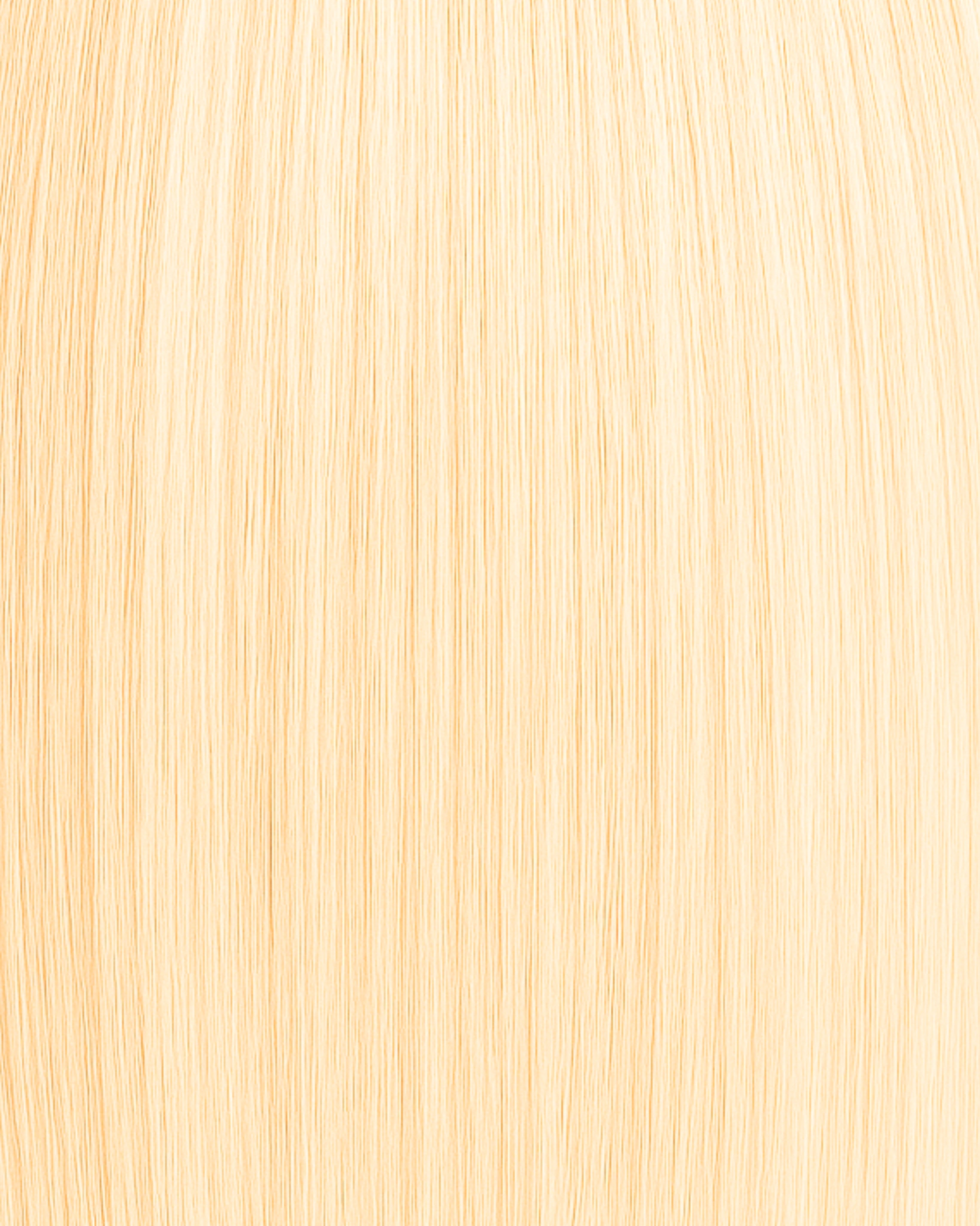 Stitched Hair Glow Genius Weft™ extensions in vanilla blonde with level 10 warm tone, shown in soft golden straight strands.