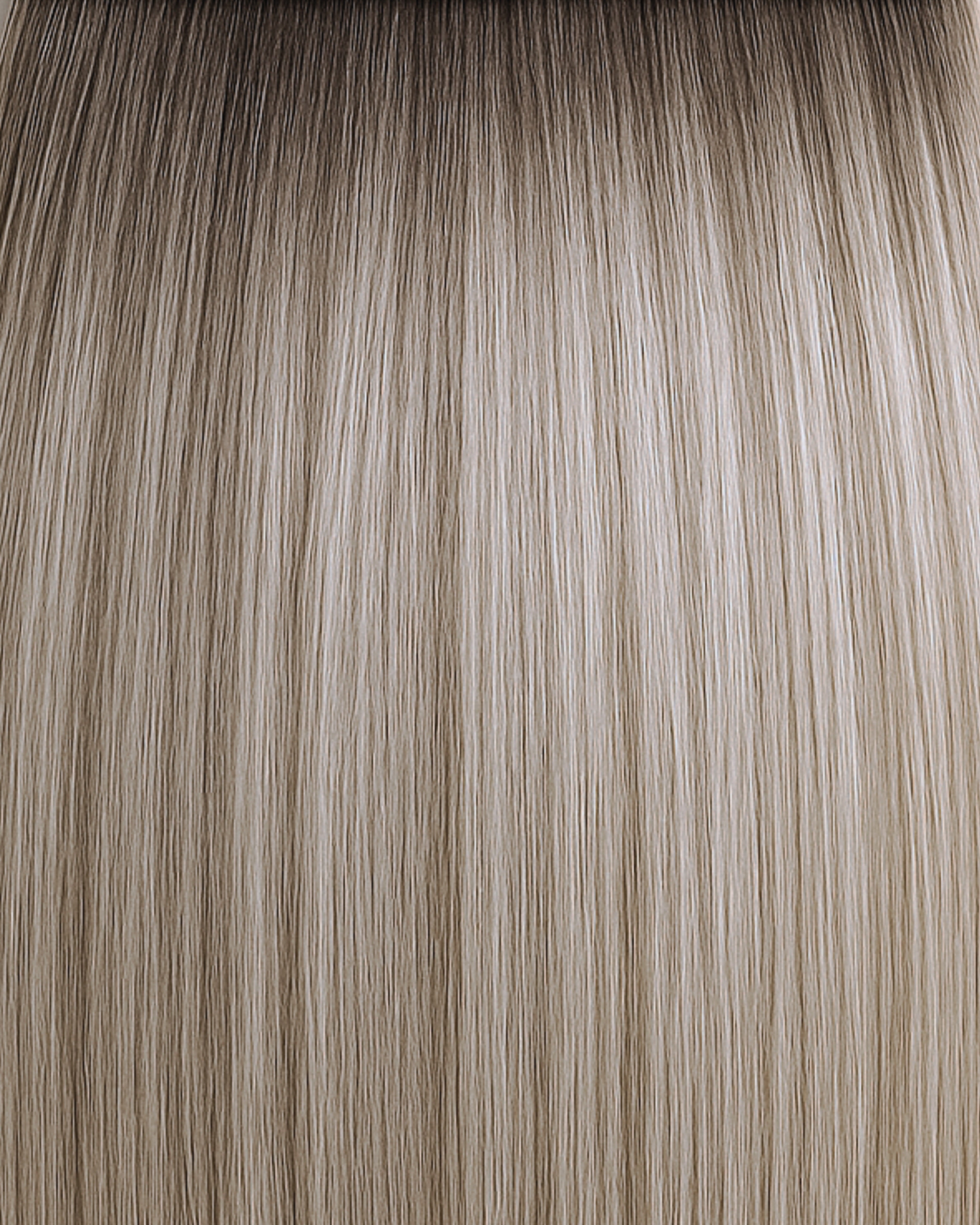 Stitched Hair Grace Genius Weft™ extensions in rooted cool dimensional blonde with 10 Ash, 7 Neutral, and level 7 root, shown in soft blended strands.