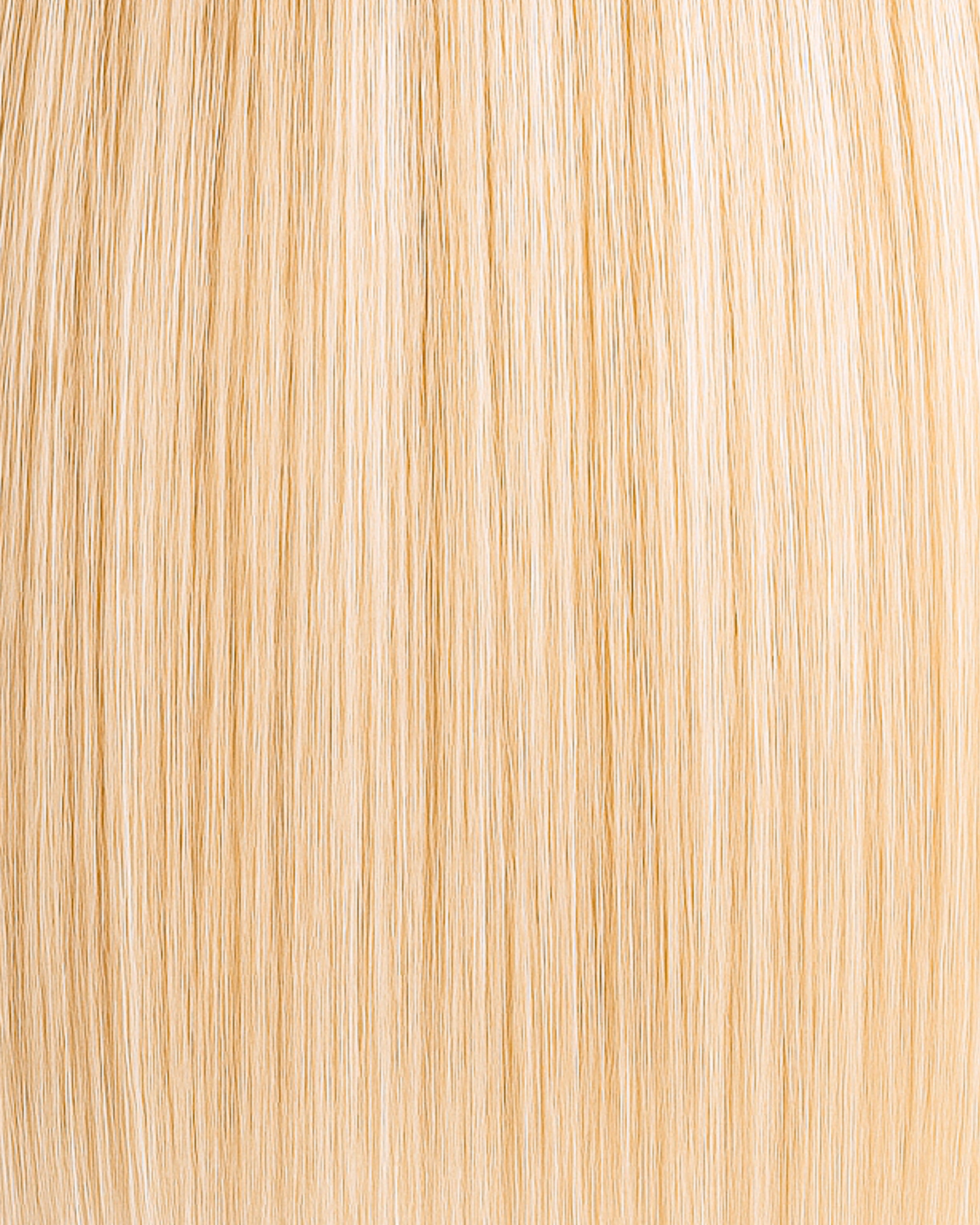 Stitched Hair Rise Seam Weft™ extensions in golden vanilla blonde with 10 warm and 9 warm blend, shown in smooth straight strands.